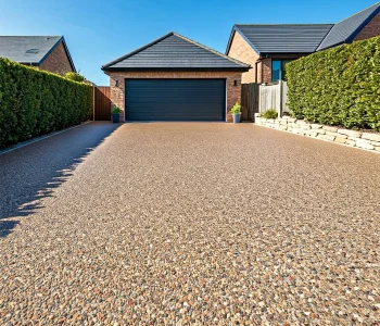 resin driveway with garage image of a large resin driveway with garage